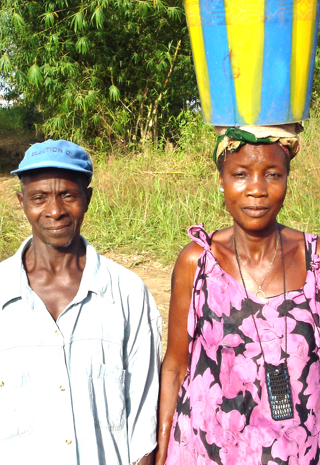 woman with bucket and husband.jpg 1 MB