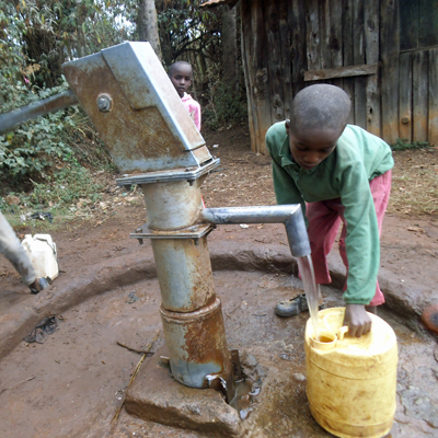 Children drawing water from Newly Repaired Pump