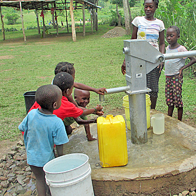 Young people around new borehole