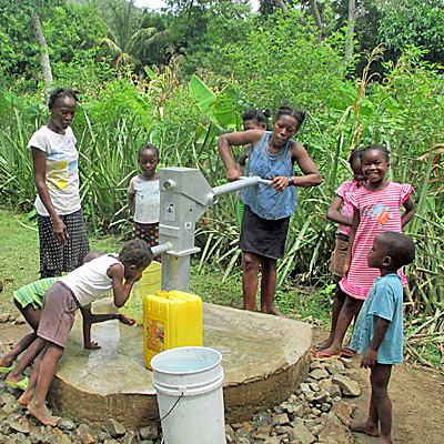 Children drawing water from New Well
