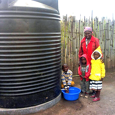 Children Drawing Water from New Tank