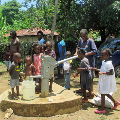 Well Caretaker and children by new well
