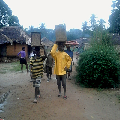 Lifewater team carrying in all needed equipment and supplies