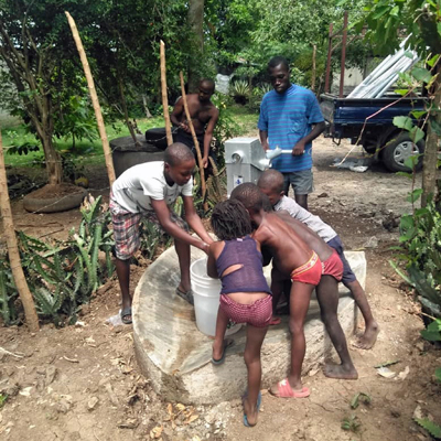 New Well with Children Feeling Cool Water