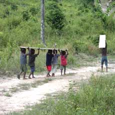 Orphans carrying Drilling Supplies in Gbargna, Liberia