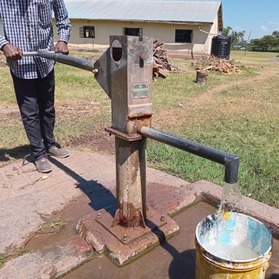 School hand pump before rehabilitation