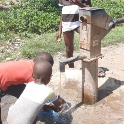 Kids at the handpump