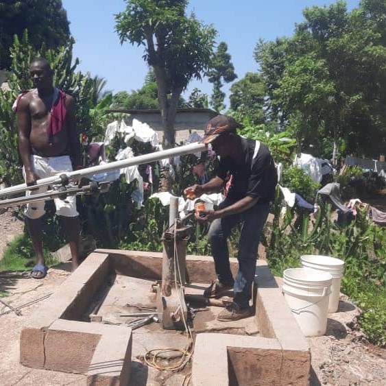 Fedan and Richard fixing handpump
