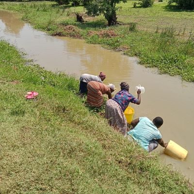 Women collecting water a stream