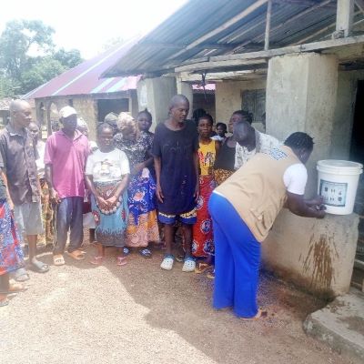 Demonstrating to community how to clean hands