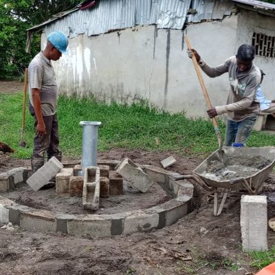 Hand pump installation on a new well underway