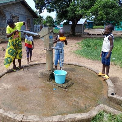 Villagers enjoying clean drinking water after pump repairs