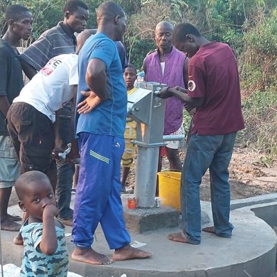 Installation of hand pump on community's new well