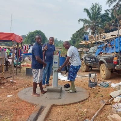 Hand pump installation in progress 