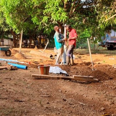 Hand pump installation in progress