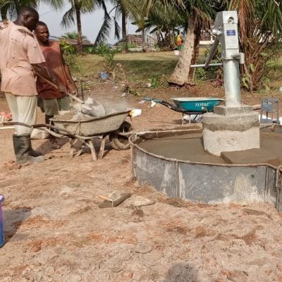 Hand pump installation in progress 