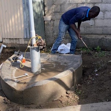 Planting the handpump on borehole