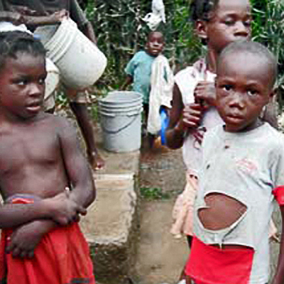 Children getting water from newly repaired pump