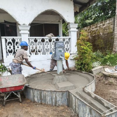 Hand pump installation in progress 