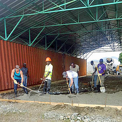 Everyone excitedly assisting with the Pour
