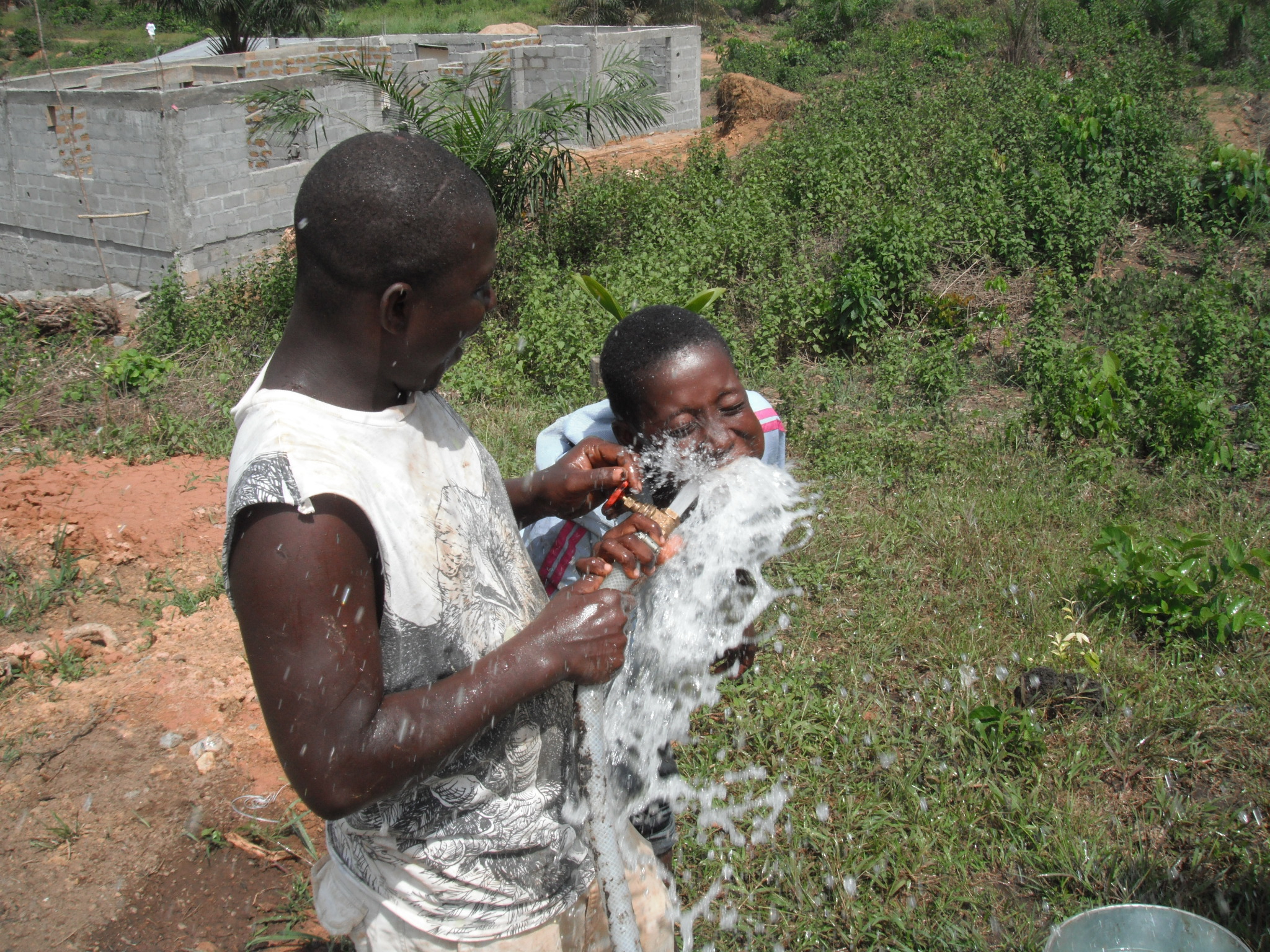 Kids enjoying the stream of safe drinking water!