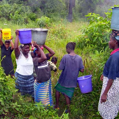 Example of impossibility of social distancing when fetching water from swamp