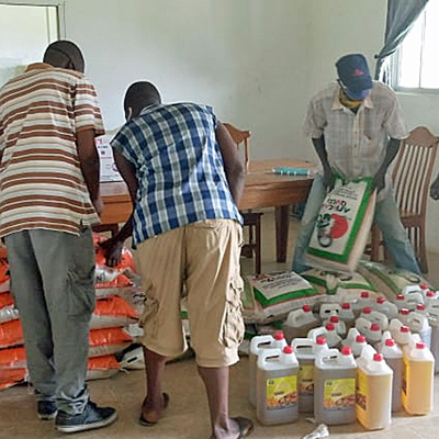 Distributing Supplies, rice, oil, masks and essentials