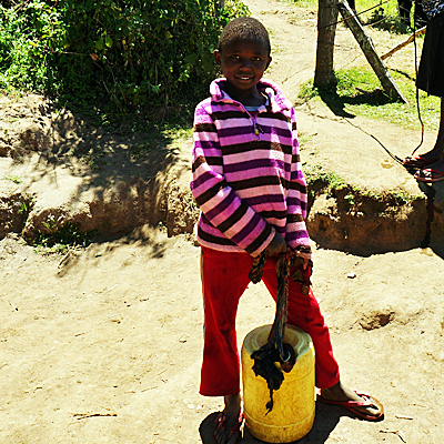 Young girl carrying water