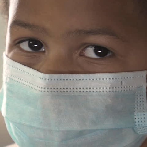 Child with new mask