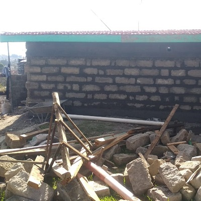 Rubble from demolished latrine