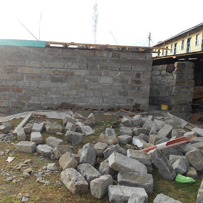 Rubble from demolished latrine