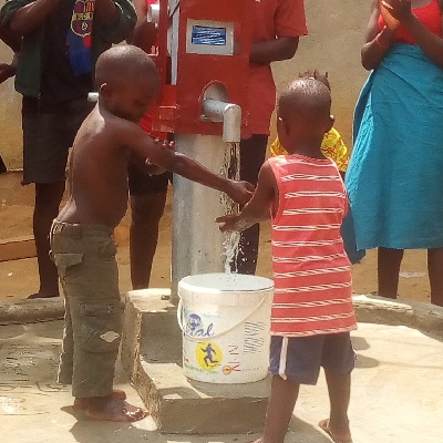 Children by the repaired well