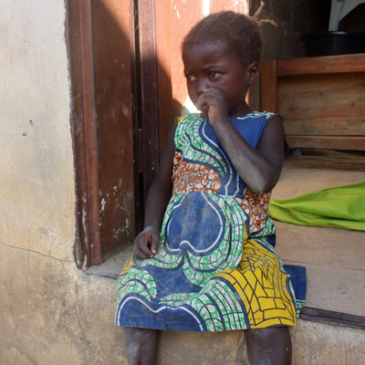 Village girl watching workers