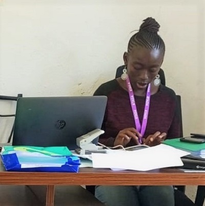 Gloria Akinyi is at work at Stada office 