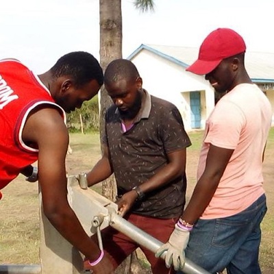 Pump repair team at work at Miguye Primary School