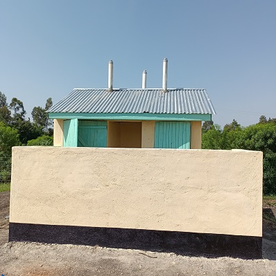 A newly constructed 6 - door latrine to serve over 500 students