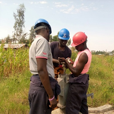 Pump repair team working to fix a pump at Bungu community 