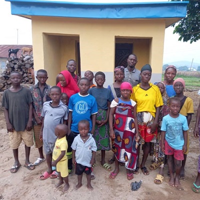 Community members in front of the washroom