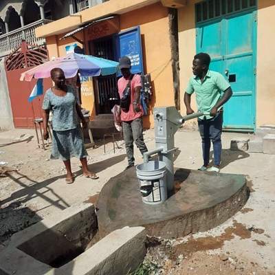 Villagers using the fixed well
