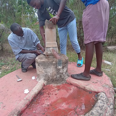 Pump repair team working to restore water to the community
