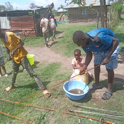 Community members happy to help with the pump repair 