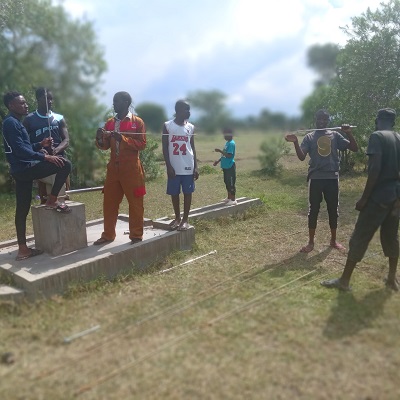 Pump repair team fixing the broken hand-pump