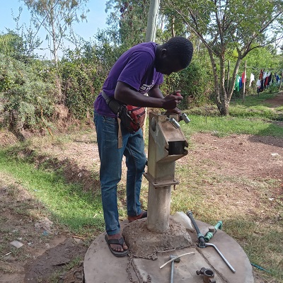 Pump repair team working to restore water to the community