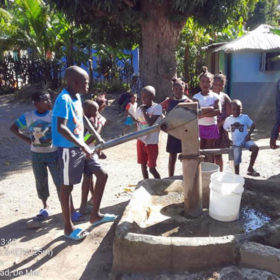 Drawing water from newly repaired well