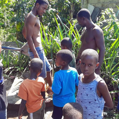 Children watching repair team
