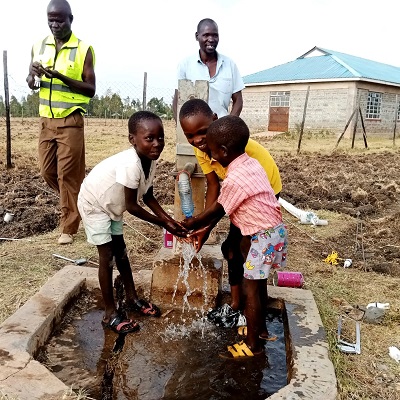 Community hand-pump producing water after repair