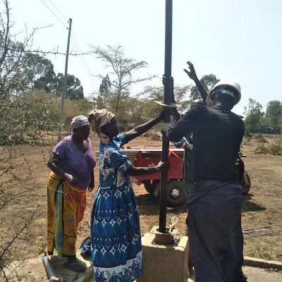 Community members happy to help with pump repair 