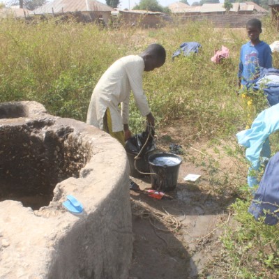 Children fetching from the community well 