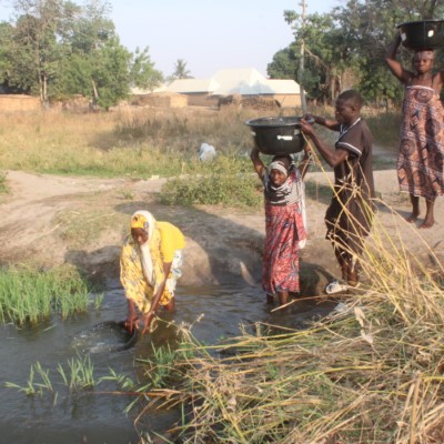 Residents fetching from the community stream 