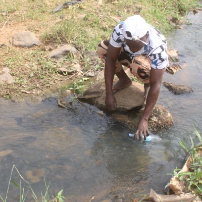 Resident fetching from the community river 